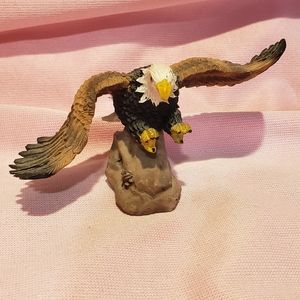 Soaring American Bald Eagle Flying Over Rocks Ceramic Figurine